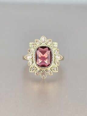 Gold Ring with Red Center Stone and Halo Petal Accents